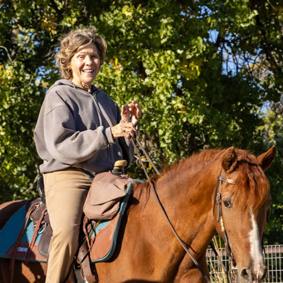 Photo of Patricia Gallegos on a horse